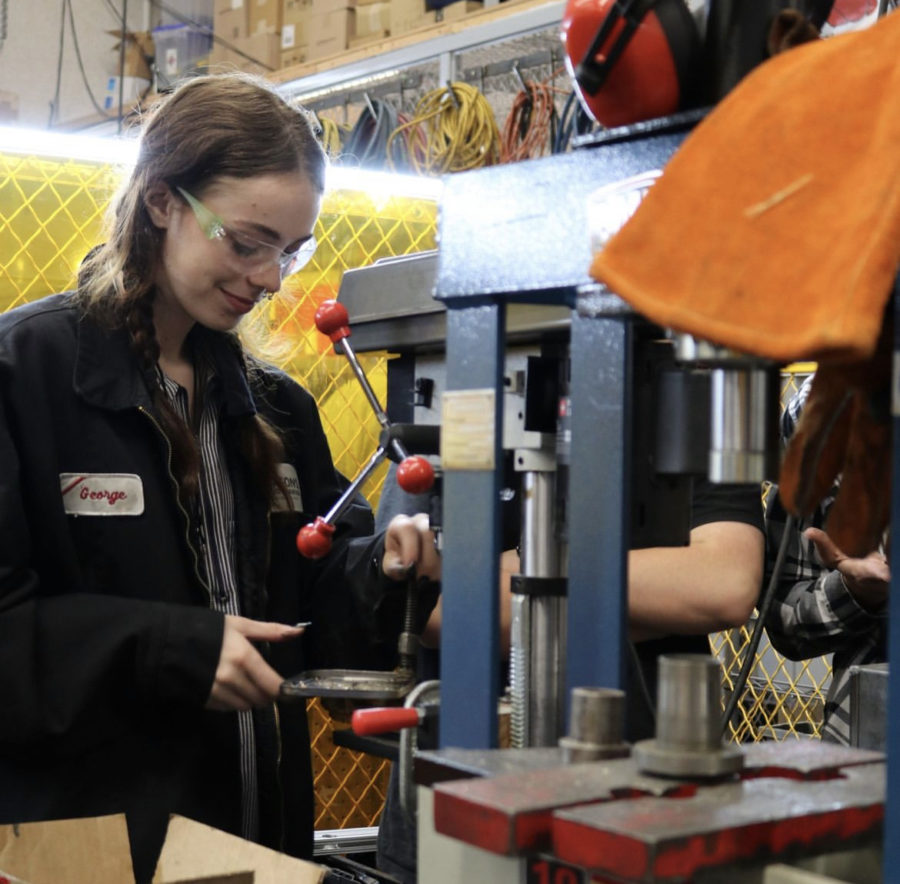 Elle Grant hard at work in the auto shop.
(Photo courtesy of Maren Bell)