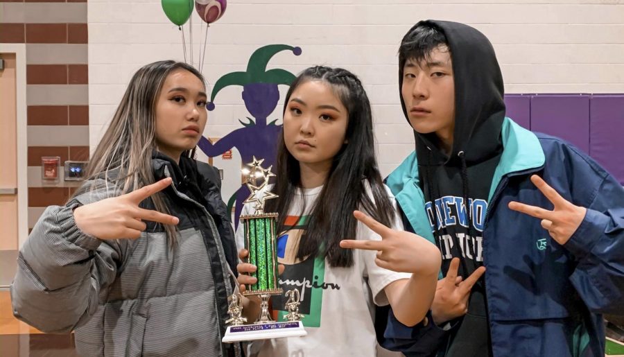 Shorewood Varsity Hip Hop captains hold the 2nd place trophy their team won at Edmonds Woodway High School earlier this school year. They also qualified for districts with more points than they have ever received.